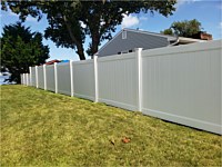 <b>White vinyl privacy fence stepped from 5 feet to 3 feet</b>